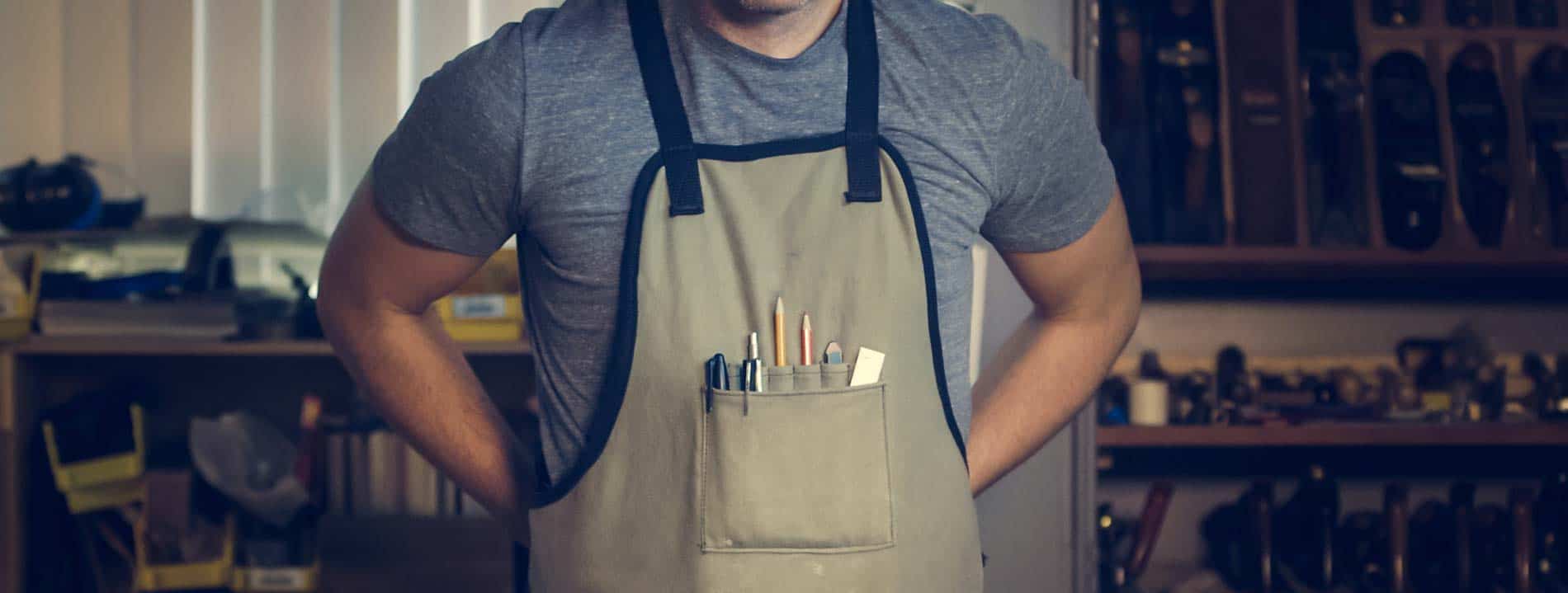 clio-websites-covid19-small-business-support-man-wearing-gray-shirt-and-apron