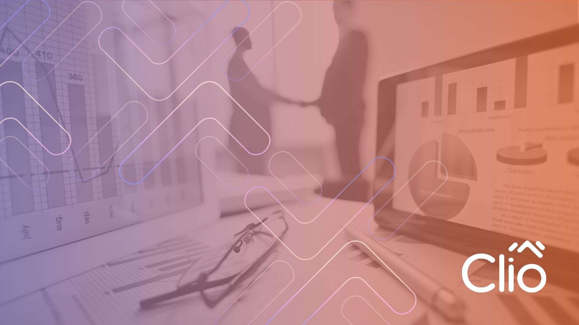 A desk with charts, graphs, glasses, and a tablet suggests strategic planning, while two blurred people shake hands in the background. The Clio logo appears in the bottom right corner, hinting at a calgary online marketing consultant collaboration. - Clio Websites | Top Canadian Web Design Company